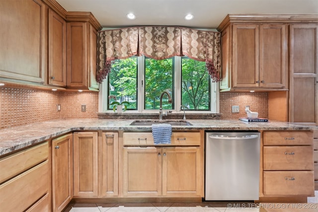 3898 E 72nd St, Tulsa, OK 74136 - kitchen with stainless steel dishwasher, a sink, light stone counters, tasteful backsplash, and recessed lighting