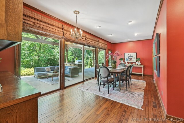 3898 E 72nd St, Tulsa, OK 74136 - dining space featuring dark wood-type flooring, a chandelier, baseboards, and recessed lighting