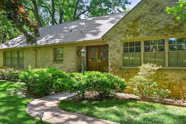 3898 E 72nd St, Tulsa, OK 74136 - view of front facade featuring stone siding and a shingled roof