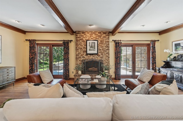 3898 E 72nd St, Tulsa, OK 74136 - living room featuring beam ceiling, a brick fireplace, wood finished floors, healthy amount of natural light, and baseboards