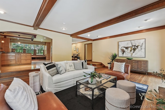 3898 E 72nd St, Tulsa, OK 74136 - living area featuring wood finished floors, beamed ceiling, ornamental molding, recessed lighting, and arched walkways