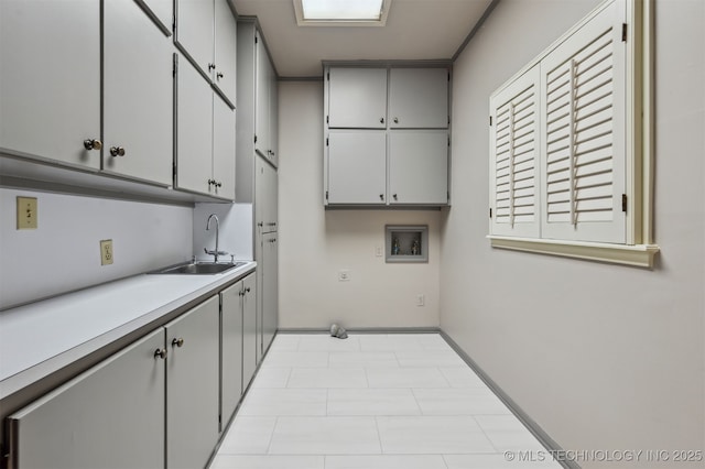 3898 E 72nd St, Tulsa, OK 74136 - laundry room with cabinet space, washer hookup, and baseboards