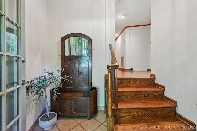 3898 E 72nd St, Tulsa, OK 74136 - foyer entrance featuring stairs, arched walkways, and light tile patterned floors