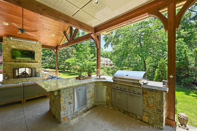 3898 E 72nd St, Tulsa, OK 74136 - view of patio / terrace featuring a multi sided fireplace, a sink, and a ceiling fan