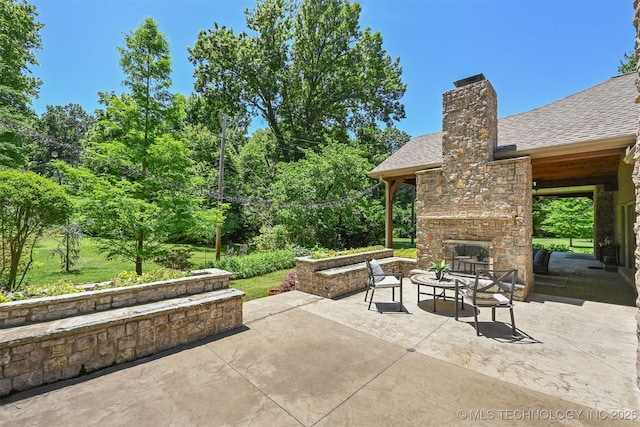 3898 E 72nd St, Tulsa, OK 74136 - view of patio / terrace featuring an outdoor stone fireplace