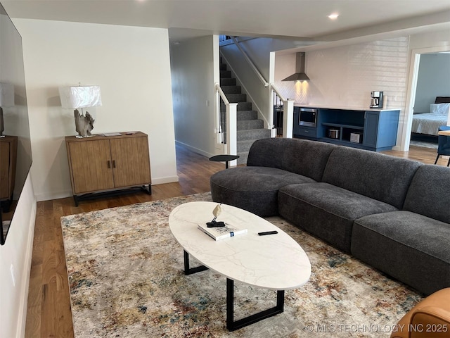 56648 Bloomer Rd, Afton, OK 74331 - living room featuring wood finished floors, stairway, baseboards, and recessed lighting