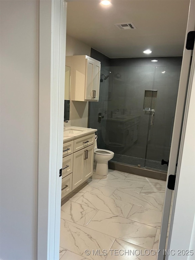 56648 Bloomer Rd, Afton, OK 74331 - full bathroom featuring vanity, a stall shower, marble finish flooring, toilet, and recessed lighting