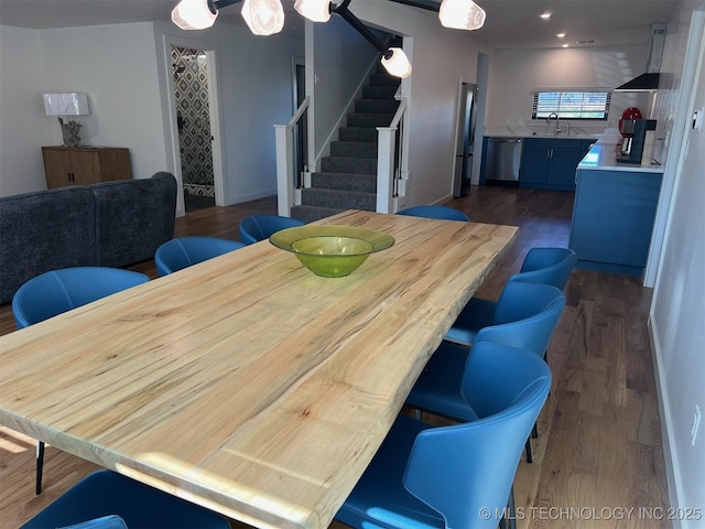 56648 Bloomer Rd, Afton, OK 74331 - dining space featuring stairway, dark wood-type flooring, and baseboards
