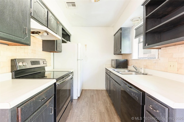 2207 Hillcrest Ct, Durant, OK 74701 - kitchen with black appliances, a sink, light wood-type flooring, and open shelves