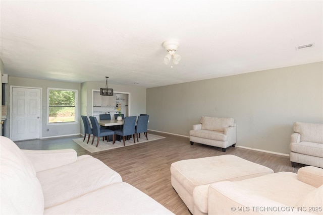 2207 Hillcrest Ct, Durant, OK 74701 - living area featuring baseboards, wood finished floors, and a ceiling fan