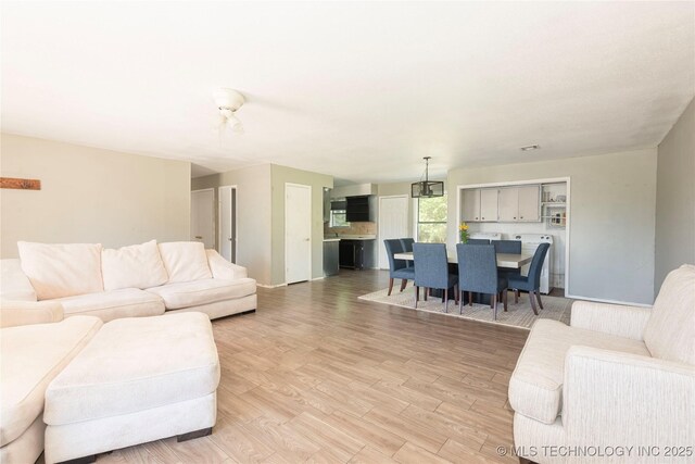 2207 Hillcrest Ct, Durant, OK 74701 - living area with light wood-style flooring and baseboards