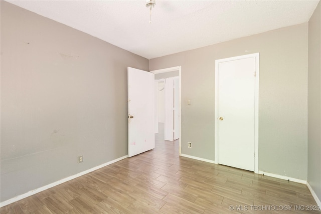 2207 Hillcrest Ct, Durant, OK 74701 - unfurnished bedroom with light wood-style flooring and baseboards
