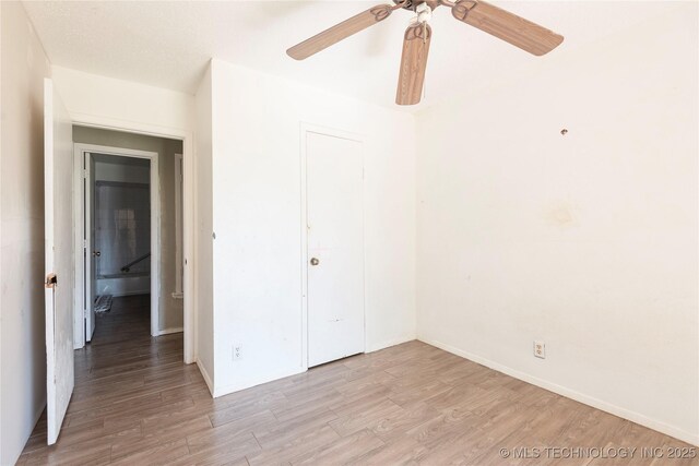 2207 Hillcrest Ct, Durant, OK 74701 - unfurnished bedroom featuring light wood-style floors, a closet, baseboards, and ceiling fan