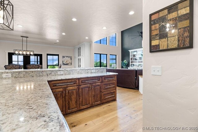 589 Three Mile Rd, Durant, OK 74701 - kitchen featuring ornamental molding, light wood-style floors, recessed lighting, ceiling fan, and open floor plan
