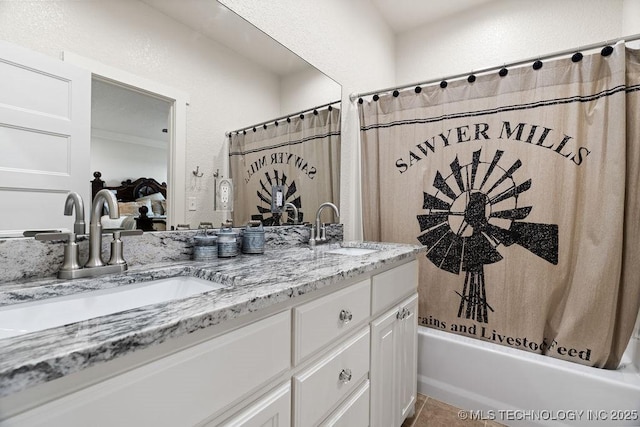 589 Three Mile Rd, Durant, OK 74701 - ensuite bathroom featuring double vanity, shower / bath combination with curtain, a textured wall, and tile patterned floors