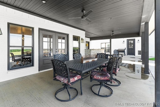 589 Three Mile Rd, Durant, OK 74701 - view of patio / terrace with ceiling fan, outdoor dining space, and french doors