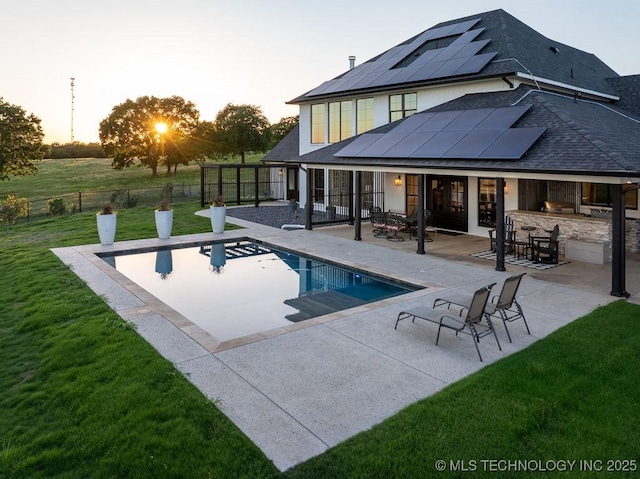 589 Three Mile Rd, Durant, OK 74701 - pool at dusk featuring a patio and an outdoor pool