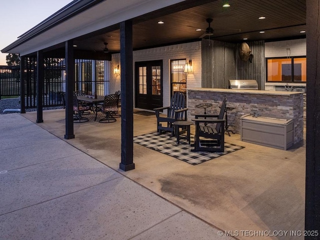 589 Three Mile Rd, Durant, OK 74701 - view of patio featuring ceiling fan, area for grilling, and french doors
