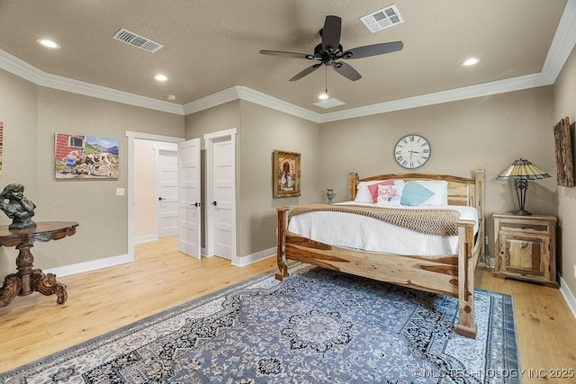 589 Three Mile Rd, Durant, OK 74701 - bedroom with wood finished floors, baseboards, recessed lighting, ornamental molding, and a ceiling fan