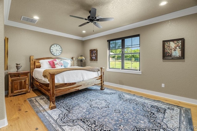589 Three Mile Rd, Durant, OK 74701 - bedroom featuring ornamental molding, light wood finished floors, a textured ceiling, ceiling fan, and recessed lighting
