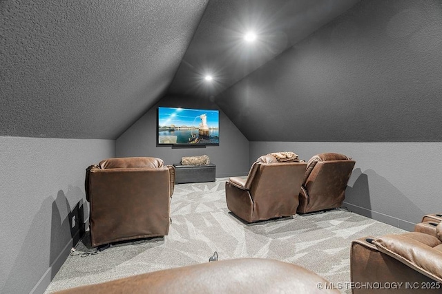 589 Three Mile Rd, Durant, OK 74701 - cinema room featuring carpet, vaulted ceiling, baseboards, and a textured wall