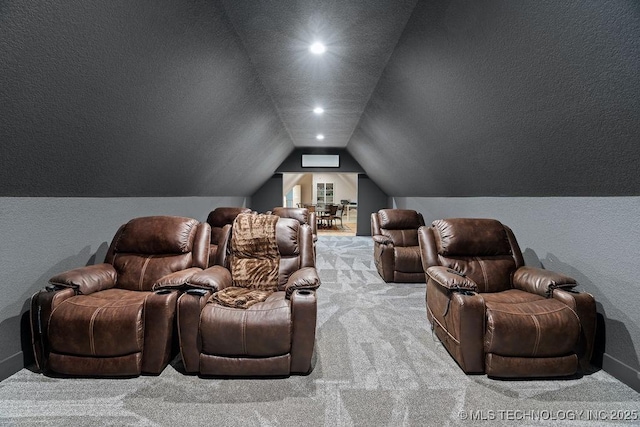 589 Three Mile Rd, Durant, OK 74701 - carpeted cinema featuring vaulted ceiling, a textured wall, and recessed lighting