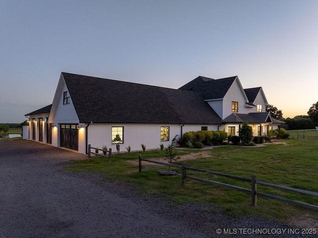 589 Three Mile Rd, Durant, OK 74701 - modern farmhouse featuring dirt driveway, a garage, and roof with shingles