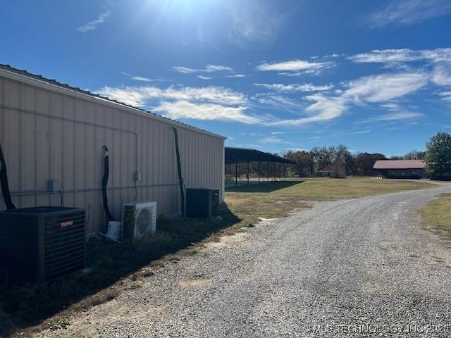 376 Lotoroc Ranch Rd, Barnsdall, OK 74002 - view of pole building with central air condition unit, a cooling unit, and driveway