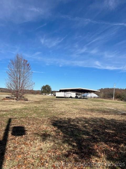 376 Lotoroc Ranch Rd, Barnsdall, OK 74002 - view of green lawn featuring a carport