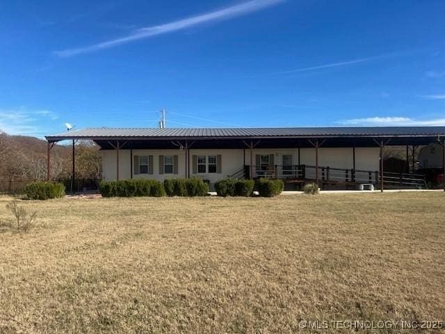 376 Lotoroc Ranch Rd, Barnsdall, OK 74002 - rear view of property with metal roof