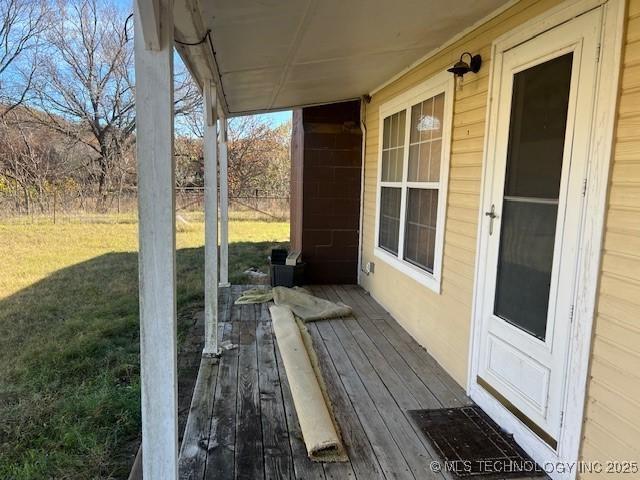 376 Lotoroc Ranch Rd, Barnsdall, OK 74002 - wooden deck featuring a lawn