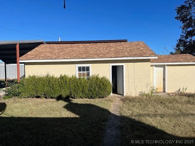 376 Lotoroc Ranch Rd, Barnsdall, OK 74002 - back of property featuring a yard and a shingled roof