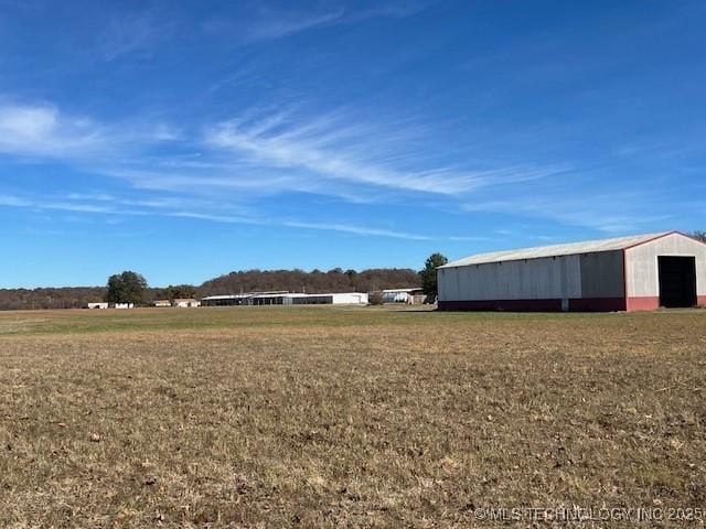 376 Lotoroc Ranch Rd, Barnsdall, OK 74002 - view of green lawn featuring a pole building, an outbuilding, and a garage