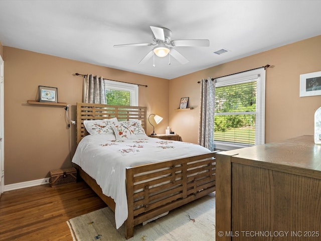 1626 S Dewey Ave, Bartlesville, OK 74003 - bedroom featuring baseboards, wood finished floors, and ceiling fan