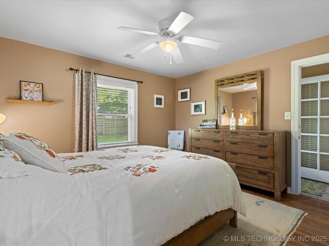 1626 S Dewey Ave, Bartlesville, OK 74003 - bedroom with wood finished floors and a ceiling fan