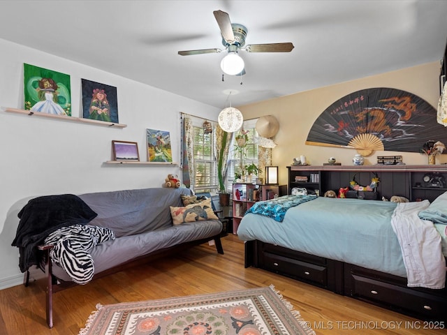 1626 S Dewey Ave, Bartlesville, OK 74003 - bedroom featuring wood finished floors and a ceiling fan