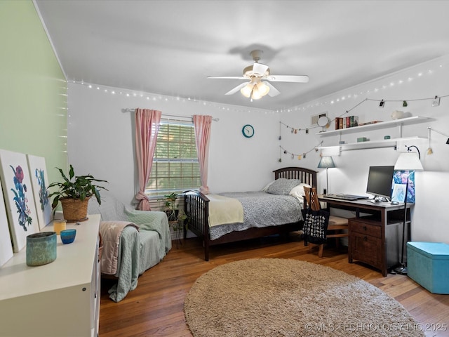 1626 S Dewey Ave, Bartlesville, OK 74003 - bedroom with wood finished floors and ceiling fan