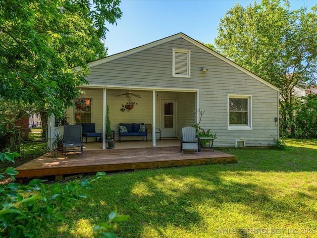 1626 S Dewey Ave, Bartlesville, OK 74003 - rear view of house featuring an outdoor living space, a deck, a ceiling fan, and a yard