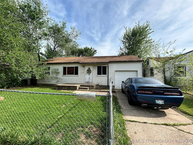 7130 E Marshall Pl, Tulsa, OK 74115 - single story home featuring an attached garage, concrete driveway, and a front lawn