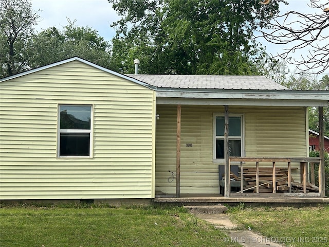 3203 E Oklahoma Pl, Tulsa, OK 74110 - back of property featuring a lawn and a shingled roof