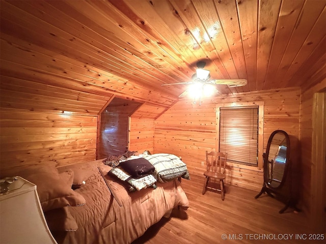7905 Hornbeam Rd, Henryetta, OK 74437 - bedroom with wooden ceiling, wooden walls, and light wood-style flooring