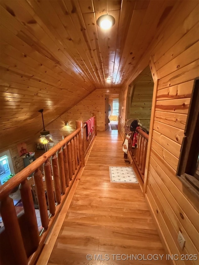 7905 Hornbeam Rd, Henryetta, OK 74437 - corridor with wooden ceiling, wood walls, light wood-style floors, and vaulted ceiling