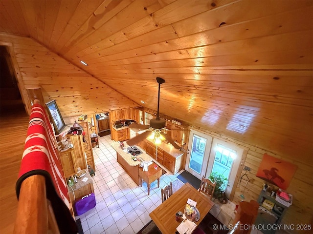 7905 Hornbeam Rd, Henryetta, OK 74437 - tiled living room featuring lofted ceiling, wood walls, wood ceiling, and a ceiling fan
