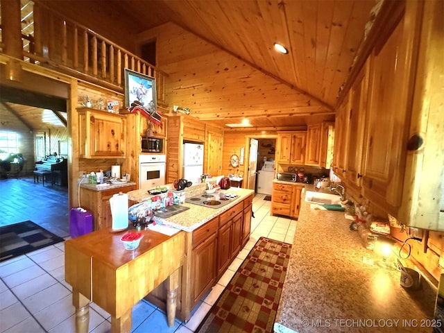 7905 Hornbeam Rd, Henryetta, OK 74437 - kitchen featuring wood walls, white appliances, wooden ceiling, high vaulted ceiling, and a center island