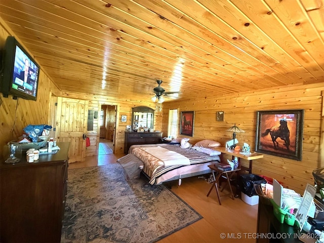 7905 Hornbeam Rd, Henryetta, OK 74437 - bedroom featuring wood walls, wood finished floors, and wood ceiling
