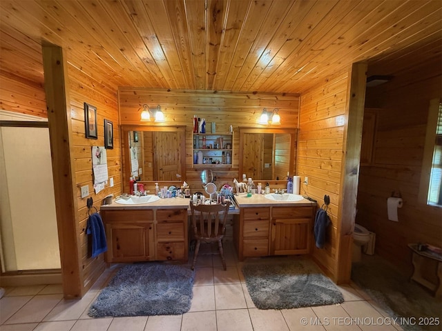 7905 Hornbeam Rd, Henryetta, OK 74437 - full bath with wooden walls, tile patterned flooring, double vanity, toilet, and wooden ceiling