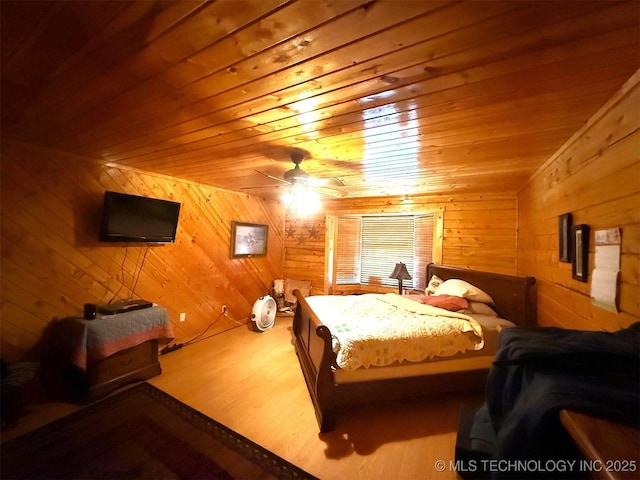 7905 Hornbeam Rd, Henryetta, OK 74437 - bedroom featuring wood walls and wood ceiling