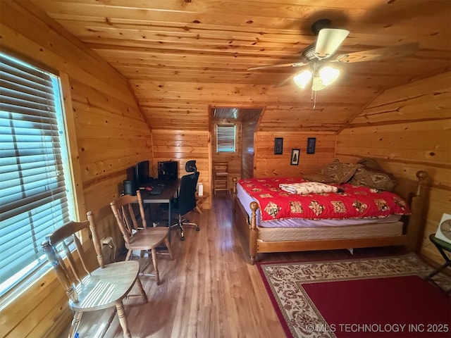 7905 Hornbeam Rd, Henryetta, OK 74437 - bedroom featuring vaulted ceiling, wood ceiling, wood finished floors, and wooden walls