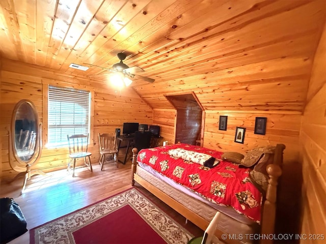7905 Hornbeam Rd, Henryetta, OK 74437 - bedroom with hardwood / wood-style flooring, wooden walls, wood ceiling, and lofted ceiling
