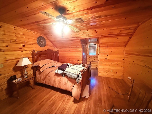 7905 Hornbeam Rd, Henryetta, OK 74437 - bedroom with wood ceiling, wood finished floors, lofted ceiling, and wood walls